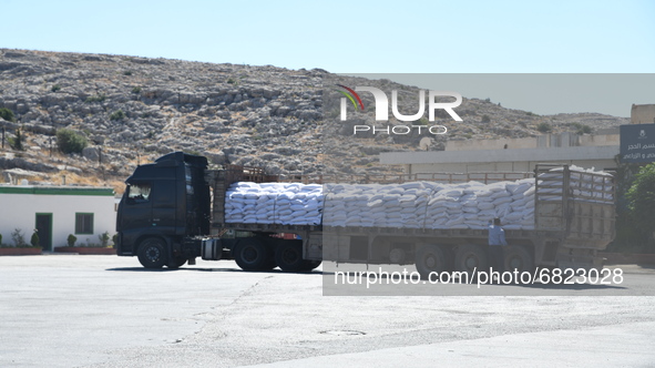 Trucks Loaded With Humanitarian Aid Provided By The United Nations World Food Program Enter Northern Syria Through Bab Al-Hawa Crossing on J...