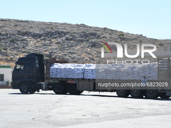 Trucks Loaded With Humanitarian Aid Provided By The United Nations World Food Program Enter Northern Syria Through Bab Al-Hawa Crossing on J...