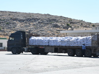 Trucks Loaded With Humanitarian Aid Provided By The United Nations World Food Program Enter Northern Syria Through Bab Al-Hawa Crossing on J...