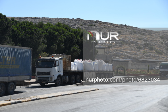 Trucks Loaded With Humanitarian Aid Provided By The United Nations World Food Program Enter Northern Syria Through Bab Al-Hawa Crossing on J...