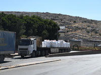 Trucks Loaded With Humanitarian Aid Provided By The United Nations World Food Program Enter Northern Syria Through Bab Al-Hawa Crossing on J...