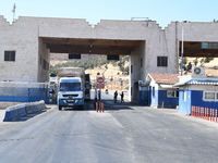 Trucks Loaded With Humanitarian Aid Provided By The United Nations World Food Program Enter Northern Syria Through Bab Al-Hawa Crossing on J...