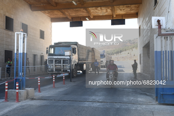 Trucks Loaded With Humanitarian Aid Provided By The United Nations World Food Program Enter Northern Syria Through Bab Al-Hawa Crossing on J...