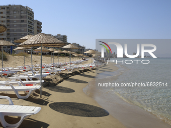 Abandoned buildings in Varosha, an area fenced off by the Turkish military since the 1974 division of Cyprus, are seen from a beach in Famag...