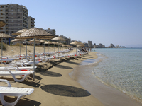 Abandoned buildings in Varosha, an area fenced off by the Turkish military since the 1974 division of Cyprus, are seen from a beach in Famag...