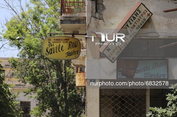 Old signs on abandoned buildings, fenced off by the Turkish military since 1974, in the abandoned coastal area of Varosha, a suburb of the c...