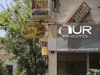 Old signs on abandoned buildings, fenced off by the Turkish military since 1974, in the abandoned coastal area of Varosha, a suburb of the c...