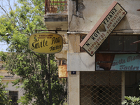 Old signs on abandoned buildings, fenced off by the Turkish military since 1974, in the abandoned coastal area of Varosha, a suburb of the c...