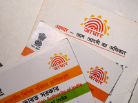 A photo taken in Tehatta, West Bengal, India on 01 July 2021 show the Aadhaar Cards issued by the Unique Identification Authority of India (...