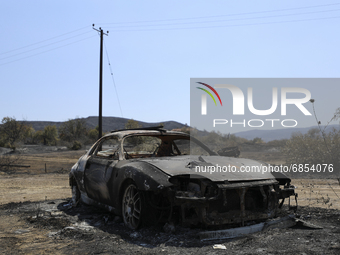 A burned car in the village Eptagonia, in the mountainous area of Limassol. Cyprus, Monday, 5 July, 2021. The wildfires that have been ragin...