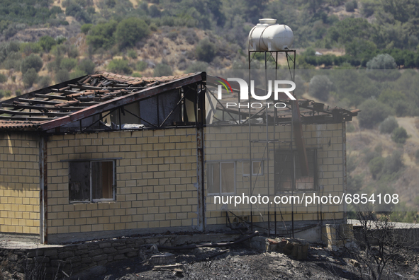 A burned house in Arakapas village, in Limassol mountain region. Cyprus, Monday, July 5, 2021. The wildfires that have been raging since 03...