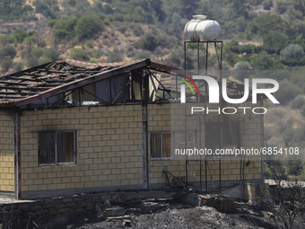 A burned house in Arakapas village, in Limassol mountain region. Cyprus, Monday, July 5, 2021. The wildfires that have been raging since 03...