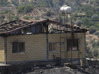 A burned house in Arakapas village, in Limassol mountain region. Cyprus, Monday, July 5, 2021. The wildfires that have been raging since 03...