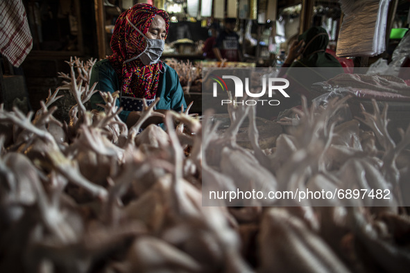 Gloomy faces of sellers and buyers at a traditional market in Pamulang area, South Tangerang, Banten, Indonesia on July 23, 2021. For almost...