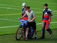  Harry McGurks machine is taken back to the pits by his mechanic and Paul Bowen  (left) and Connor Coles  during the National Development L...