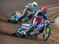   Jack Parkinson-Blackburn  (Red) leads Danno Verge  (Yellow) during the National Development League match between Belle Vue Colts and Eastb...
