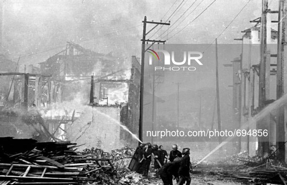 (150717) -- BEIJING, July 17, 2015 () -- File  people trying to put out fire after air-strikes carried out by Japanese army in southwest Chi...