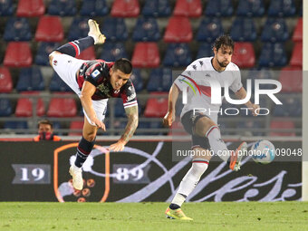 Kevin Bonifazi (Bologna F.C.) (left) competes for the ball with Mattia Destro (Genoa CFC)  during the Italian Serie A soccer match Bologna F...