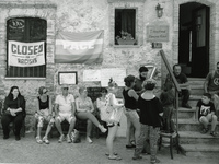 Mimmo Lucano, former mayor of Riace (on the right, sitting on the stairs) is pictured in this photograph during the days of his hunger strik...