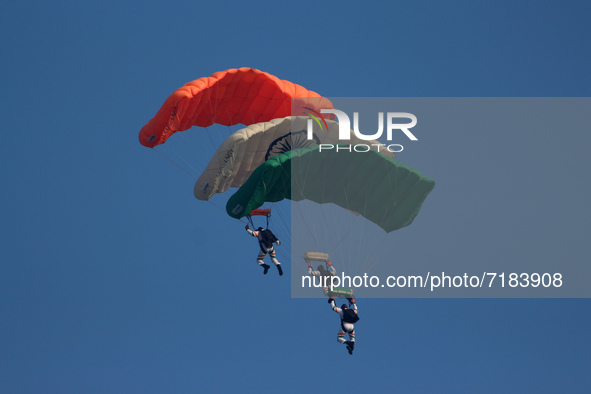 Indian Air Force's Akash Ganga sky diving team members display their skill during the full dress rehearsal of Air Force Day parade at the Hi...