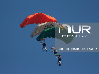 Indian Air Force's Akash Ganga sky diving team members display their skill during the full dress rehearsal of Air Force Day parade at the Hi...