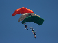 Indian Air Force's Akash Ganga sky diving team members display their skill during the full dress rehearsal of Air Force Day parade at the Hi...