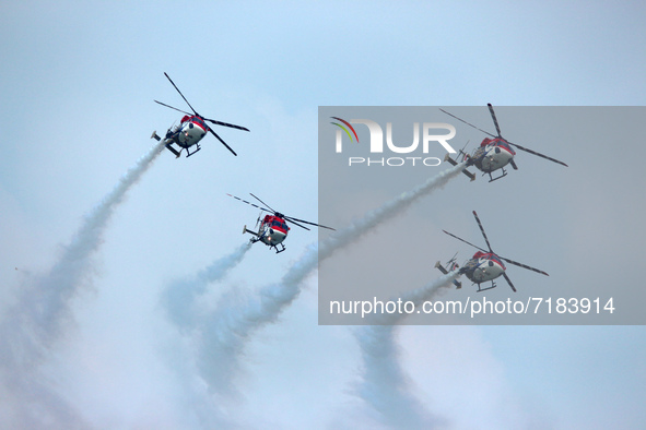 Indian Air Force's Sarang helicopters perform during the full dress rehearsal of Air Force Day parade at the Hindon Air Force Station on the...