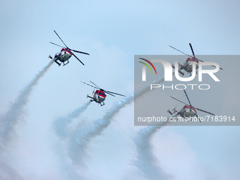 Indian Air Force's Sarang helicopters perform during the full dress rehearsal of Air Force Day parade at the Hindon Air Force Station on the...