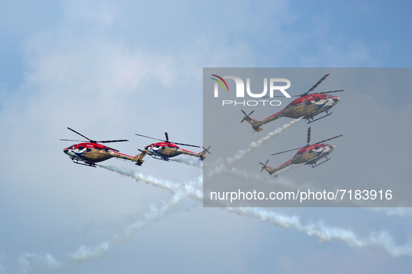 Indian Air Force's Sarang helicopters perform during the full dress rehearsal of Air Force Day parade at the Hindon Air Force Station on the...