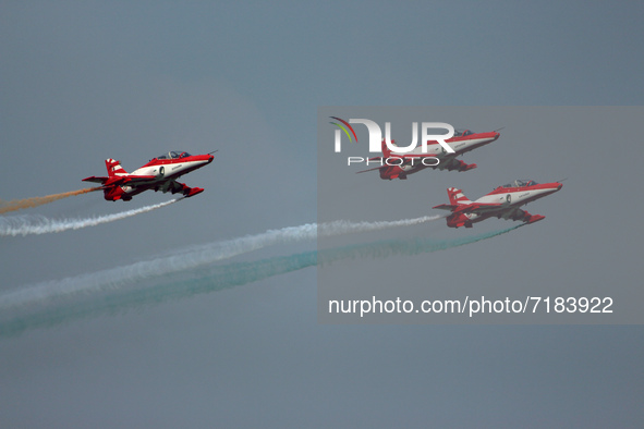 Indian Air Force's acrobatic team 'Surya Kiran' fly in a formation during the full dress rehearsal of Air Force Day parade at the Hindon Air...