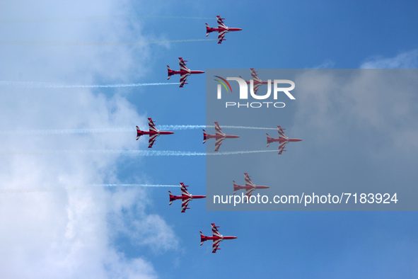 Indian Air Force's acrobatic team 'Surya Kiran' fly in a formation during the full dress rehearsal of Air Force Day parade at the Hindon Air...