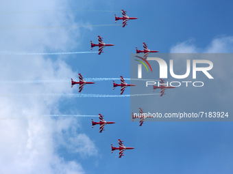 Indian Air Force's acrobatic team 'Surya Kiran' fly in a formation during the full dress rehearsal of Air Force Day parade at the Hindon Air...