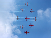 Indian Air Force's acrobatic team 'Surya Kiran' fly in a formation during the full dress rehearsal of Air Force Day parade at the Hindon Air...