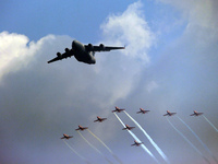 Indian Air Force's C-17 Globemaster (C) along with acrobatic team 'Surya Kiran' fly in a formation during the full dress rehearsal of Air Fo...