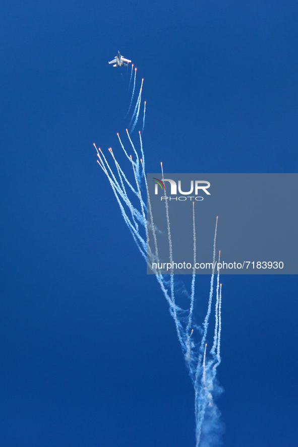 Indian Air Force's fighter aircraft Sukhoi Su-30MKI fires flares during the full dress rehearsal of Air Force Day parade at the Hindon Air F...