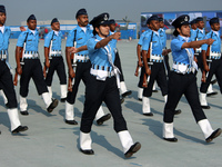 An Indian Air Force officer leads a marching contingent during the full dress rehearsal of Air Force Day parade at the Hindon Air Force Stat...