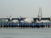 Indian Air Force (IAF) soldiers march past during the 89th Air Force Day parade at Hindon Air Force Station on the outskirts of New Delhi, I...