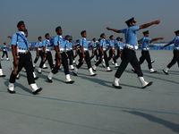 Indian Air Force (IAF) soldiers march past during the 89th Air Force Day parade at Hindon Air Force Station on the outskirts of New Delhi, I...