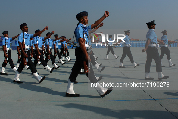 Indian Air Force (IAF) soldiers march past during the 89th Air Force Day parade at Hindon Air Force Station on the outskirts of New Delhi, I...