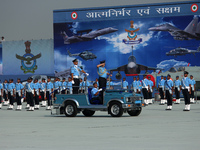 Indian Air Force's (IAF) Chief Marshal V R Chaudhari (R) inspects a guard of honor during the 89th Air Force Day parade at Hindon Air Force...