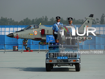 Indian Air Force's (IAF) Chief Marshal V R Chaudhari (R) inspects a guard of honor during the 89th Air Force Day parade at Hindon Air Force...