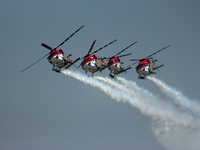 Indian Air Force's (IAF) Sarang helicopters perform during the 89th Air Force Day parade at Hindon Air Force Station on the outskirts of New...