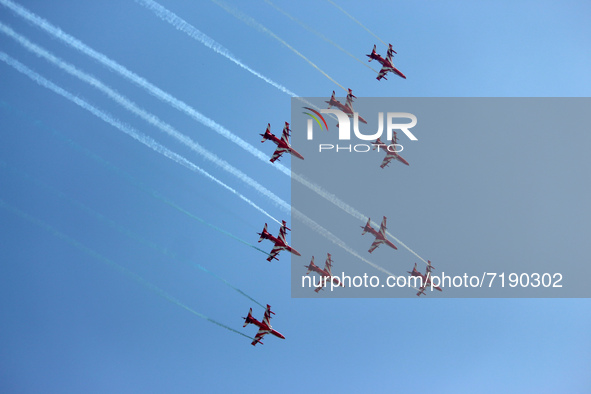 Indian Air Force's (IAF) acrobatic team 'Surya Kiran' fly in a formation during the 89th Air Force Day parade at Hindon Air Force Station on...