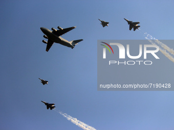 Indian Air Force's (IAF) C-17 Globemaster (C) along with two Sukhoi Su-30MKI's and two Tejas fighter aircrafts fly past during the 89th Air...