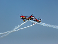 Indian Air Force's (IAF) Sarang helicopters perform aerobatic maneuvers during the 89th Air Force Day parade at Hindon Air Force Station on...