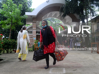 Girl students arrive at Dhaka University as reopen their residential halls after 18 months due to coronavirus emergency in Dhaka, Bangladesh...