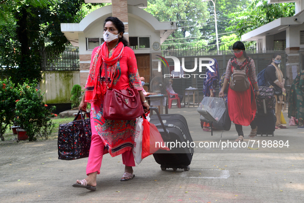 Girl students arrive at Dhaka University as reopen their residential halls after 18 months due to coronavirus emergency in Dhaka, Bangladesh...