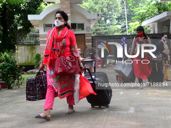 Girl students arrive at Dhaka University as reopen their residential halls after 18 months due to coronavirus emergency in Dhaka, Bangladesh...