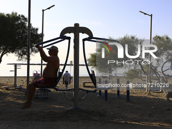 A man is exercising on a simulator on 
Power Beach in Limassol. Cyprus, Wednesday, October 13, 2021. Every second resident of Cyprus does n...