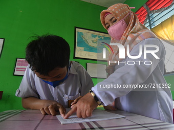 A number of students with disabilities participate in limited face-to-face learning at the Special School of SLB ABCD Muhammadiyah in Palu,...